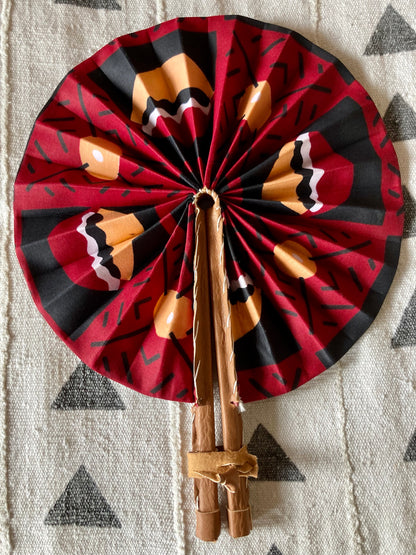 Fan- Collapses for easy storage, made from African wax fabric