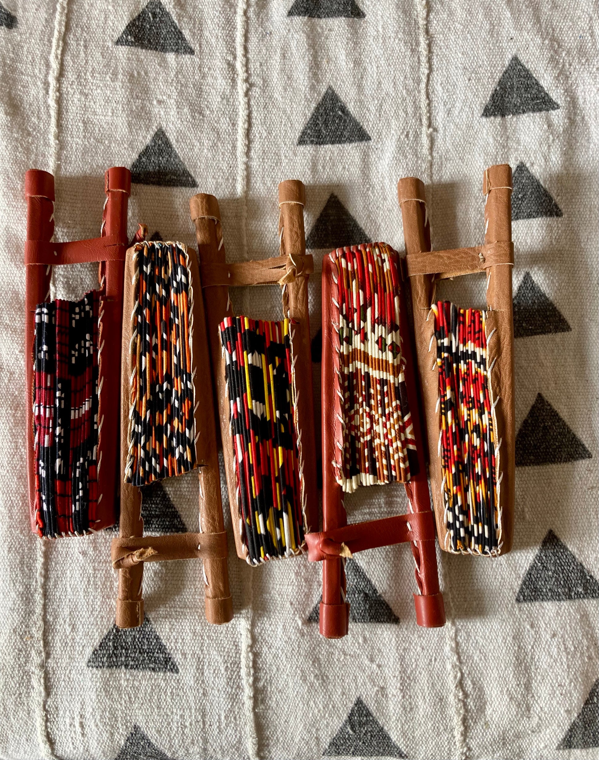 Fan- Collapses for easy storage, made from African wax fabric