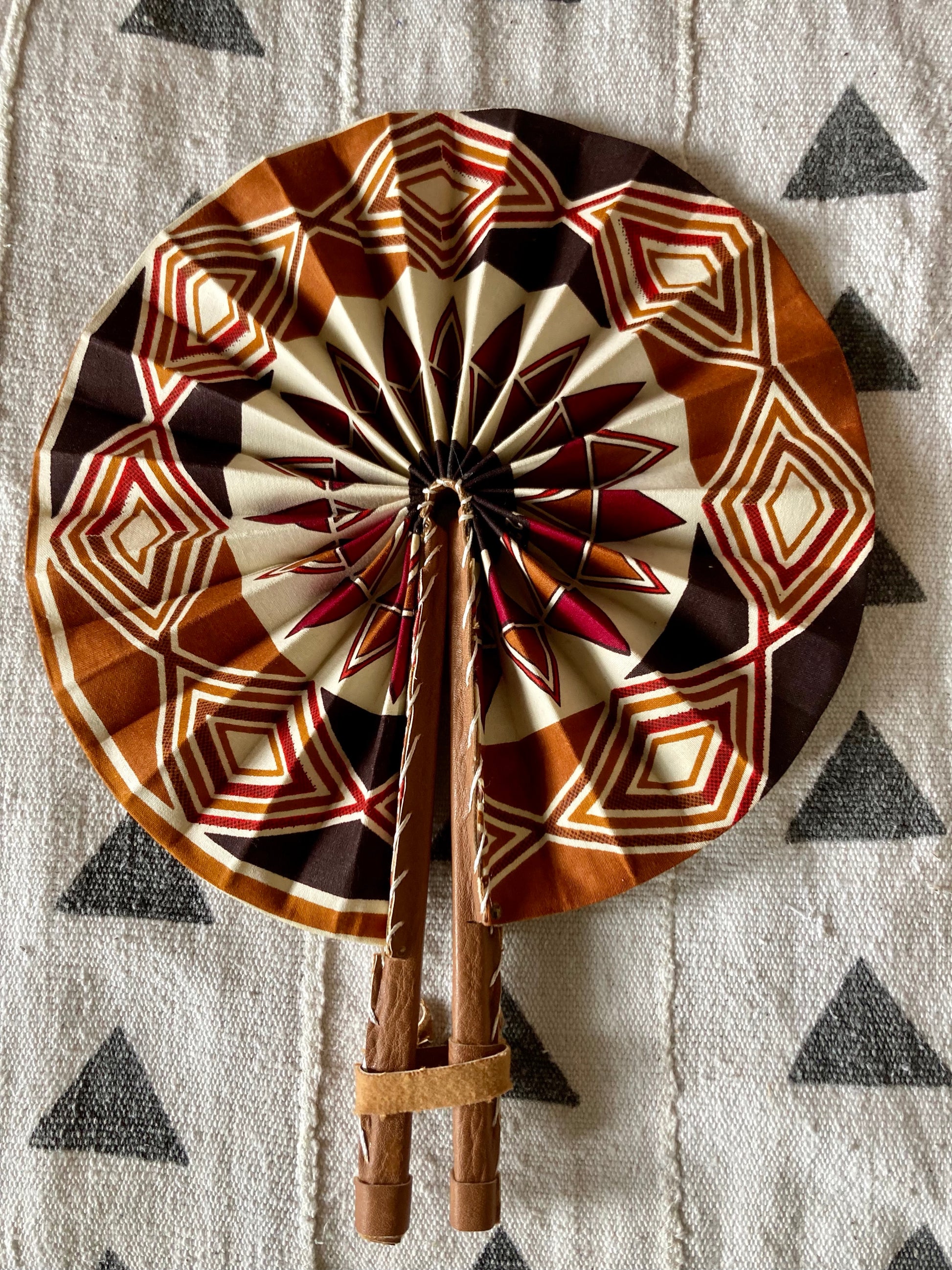 Fan - folds up for convenient storage, made out of African wax fabric